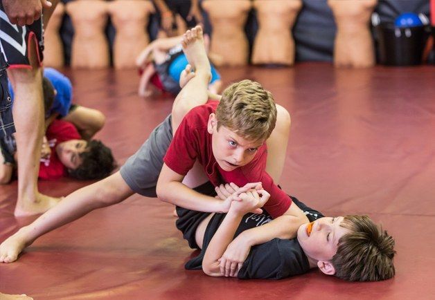 Two young boys practicing MMA