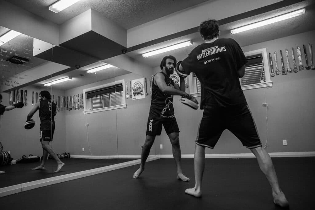 Kenny training a student Bravé MMA And Fitness